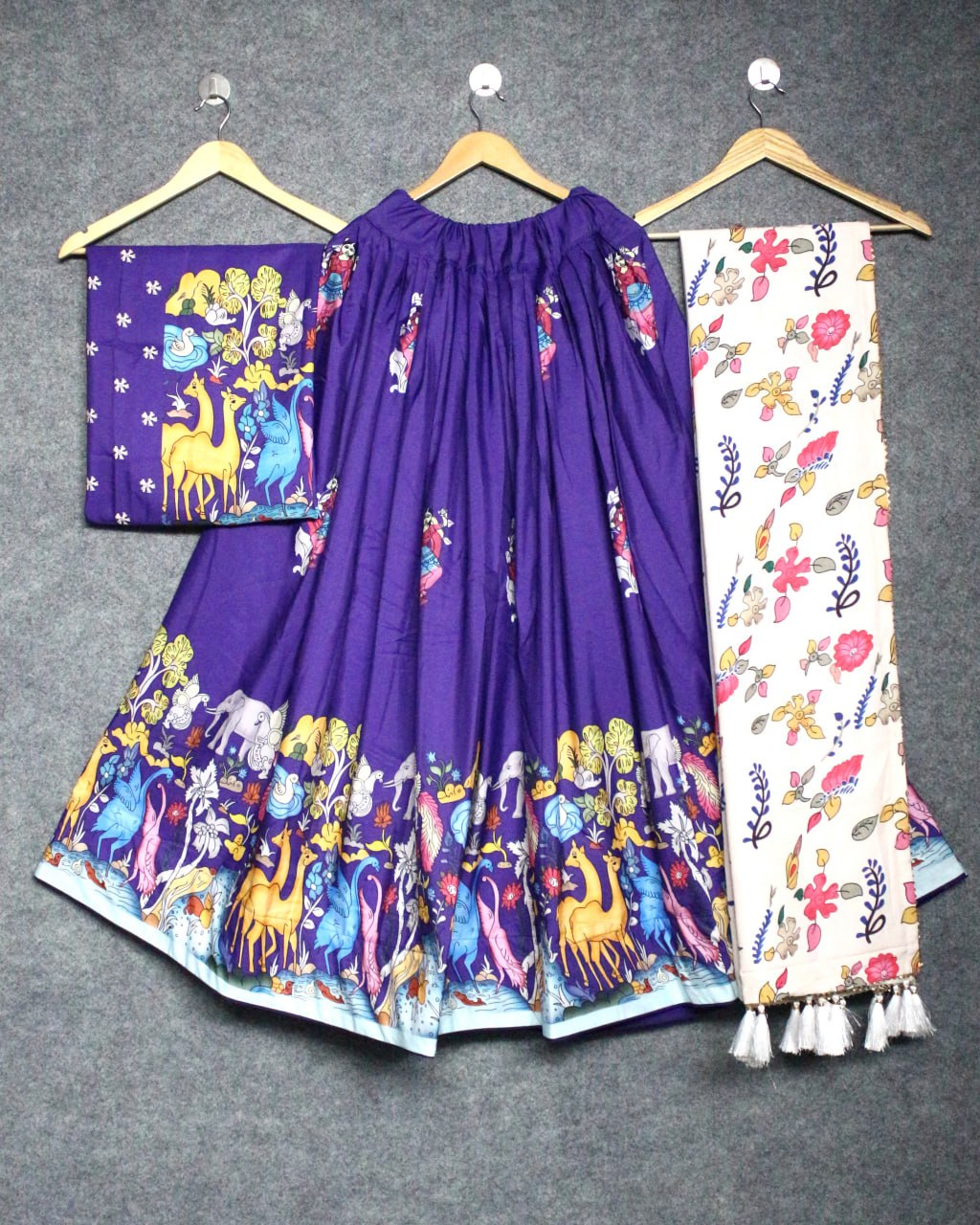 Vibrant Purple Ethnic Lehenga with Animal Motif Design and Floral Dupatta